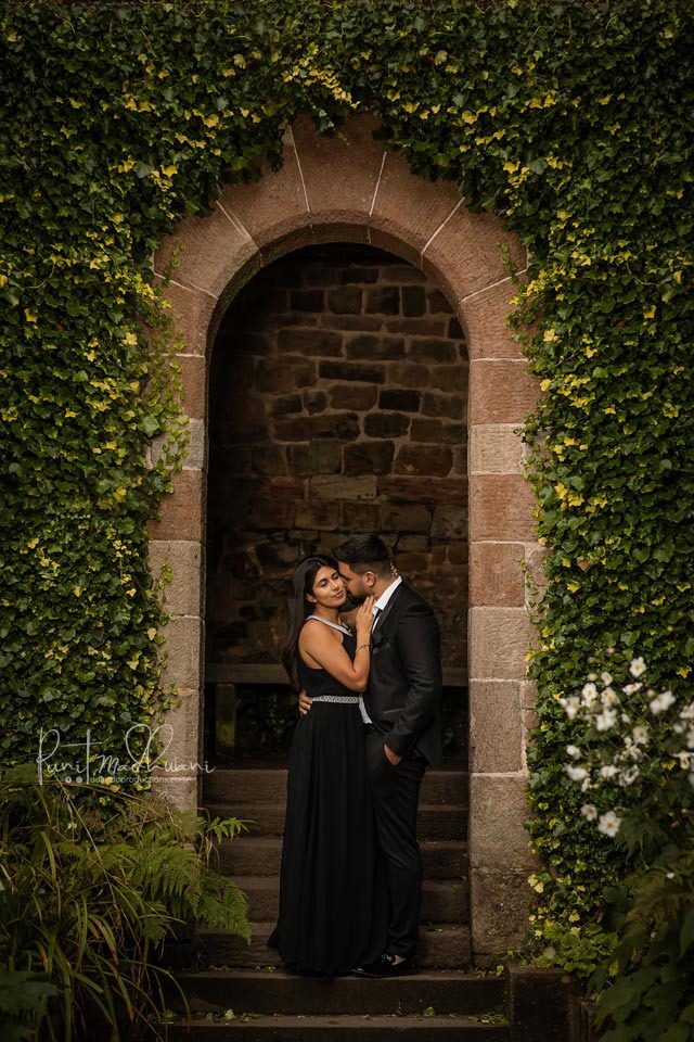 Luxury Asian wedding couple portrait under a beautiful archway